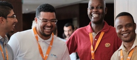 A group of men smiling