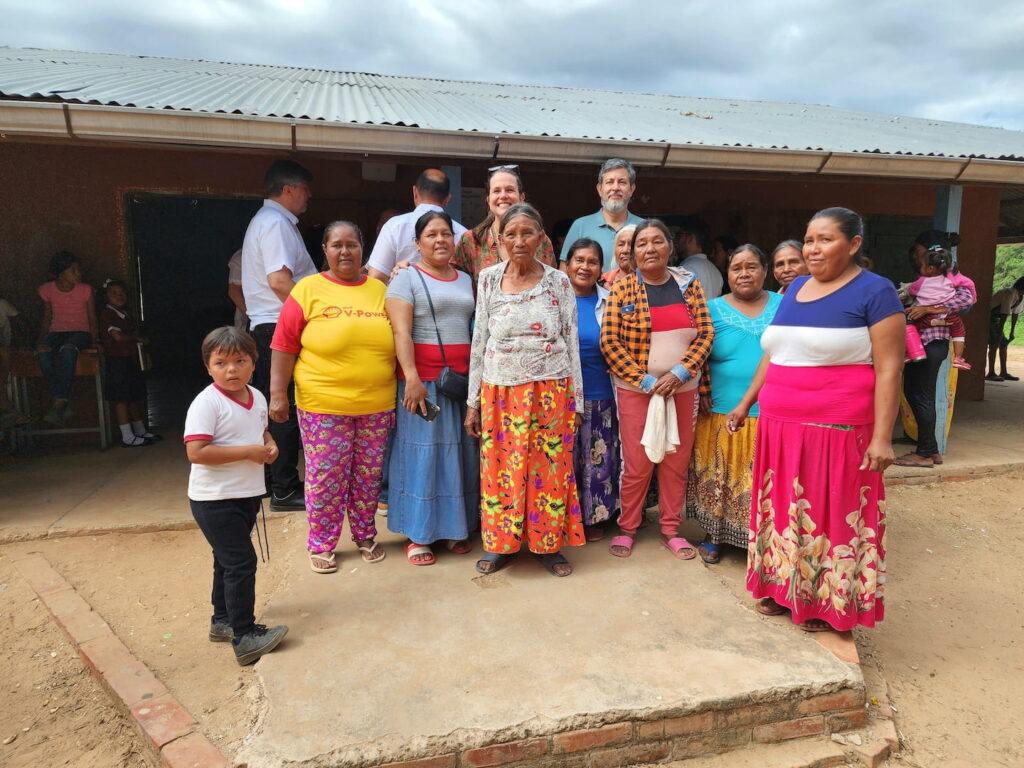 Multicultural individuals posing in front of an urban structure