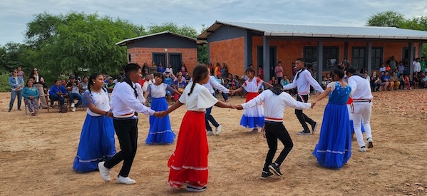 A group of kids joyfully dancing outdoors